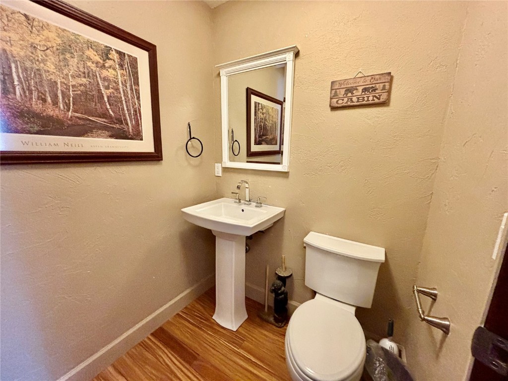 1310 Baldy Road, Unit D Breckenridge, CO 80424 - Photo 16 of 28 a bathroom with a toilet sink and mirror