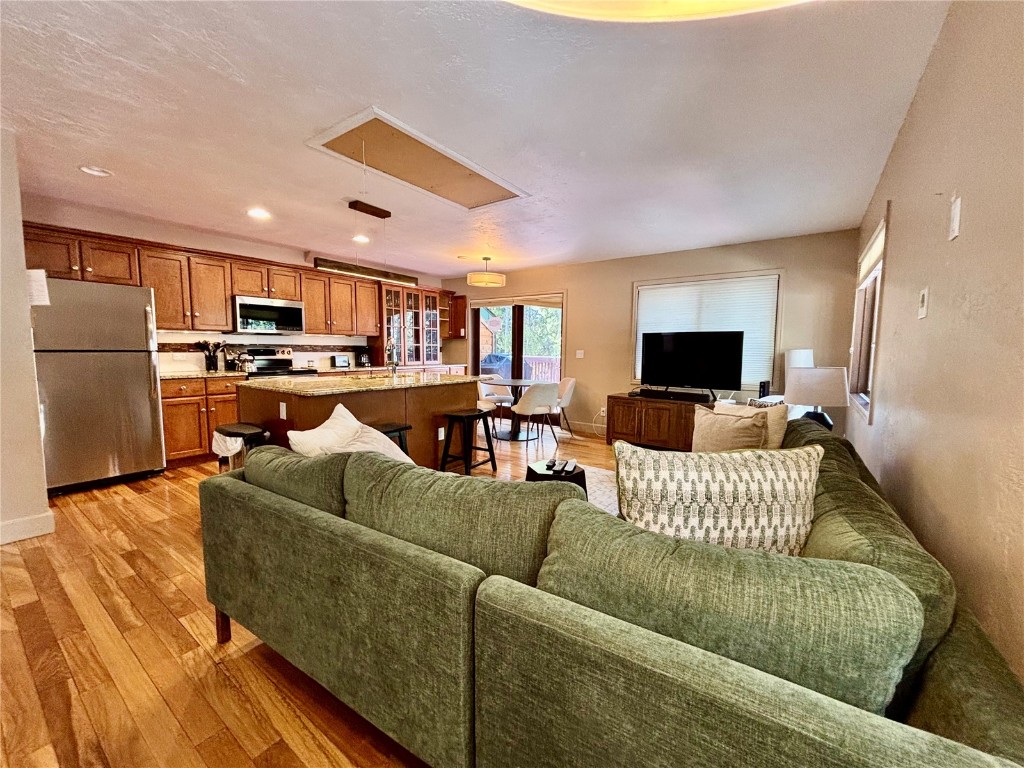 1310 Baldy Road, Unit D Breckenridge, CO 80424 - Photo 2 of 28 a living room with furniture kitchen and a fireplace