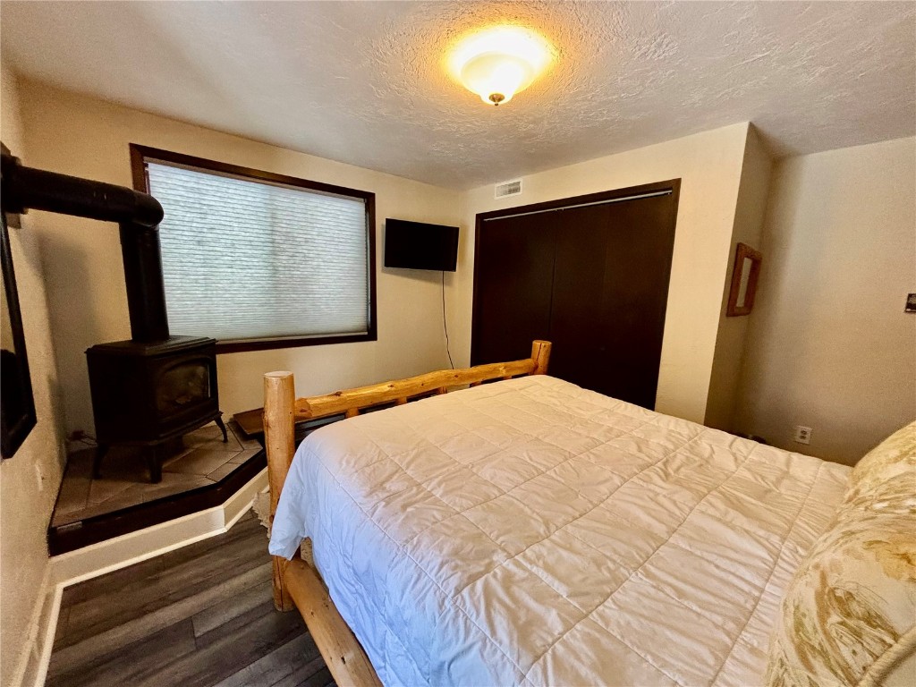 1310 Baldy Road, Unit D Breckenridge, CO 80424 - Photo 25 of 28 a bedroom with a bed and a flat screen tv