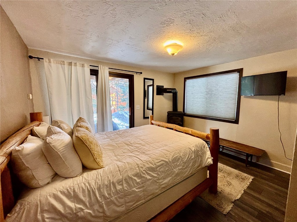 1310 Baldy Road, Unit D Breckenridge, CO 80424 - Photo 26 of 28 a bedroom with a bed and a flat screen tv