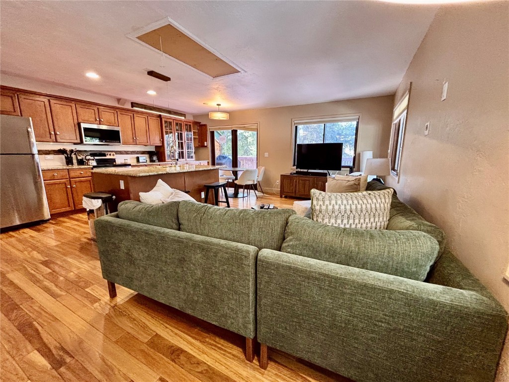 1310 Baldy Road, Unit D Breckenridge, CO 80424 - Photo 4 of 28 a living room with furniture and a flat screen tv