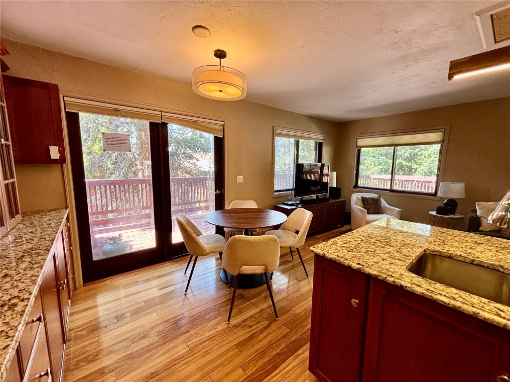 1310 Baldy Road, Unit D Breckenridge, CO 80424 - Photo 8 of 28 a view of a dining room with furniture and wooden floor