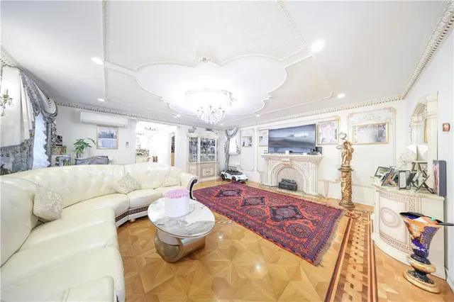 a spacious bedroom with a bed and a chandelier