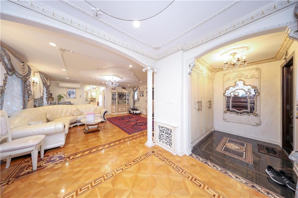 2568 East 2nd Street Brooklyn, NY 11223 - Photo 16 of 41 a living room with furniture and a flat screen tv