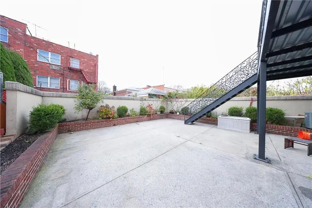 a view of a city street with furniture