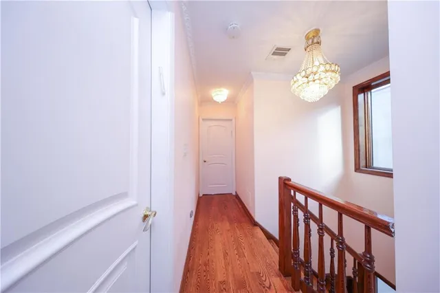 a view of a hallway with staircase