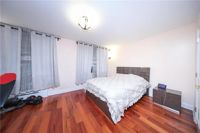 a room with a bed and a dresser