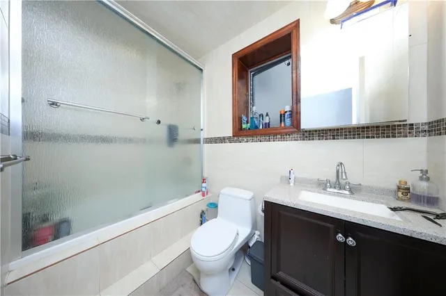 a kitchen with stainless steel appliances granite countertop a stove and a microwave