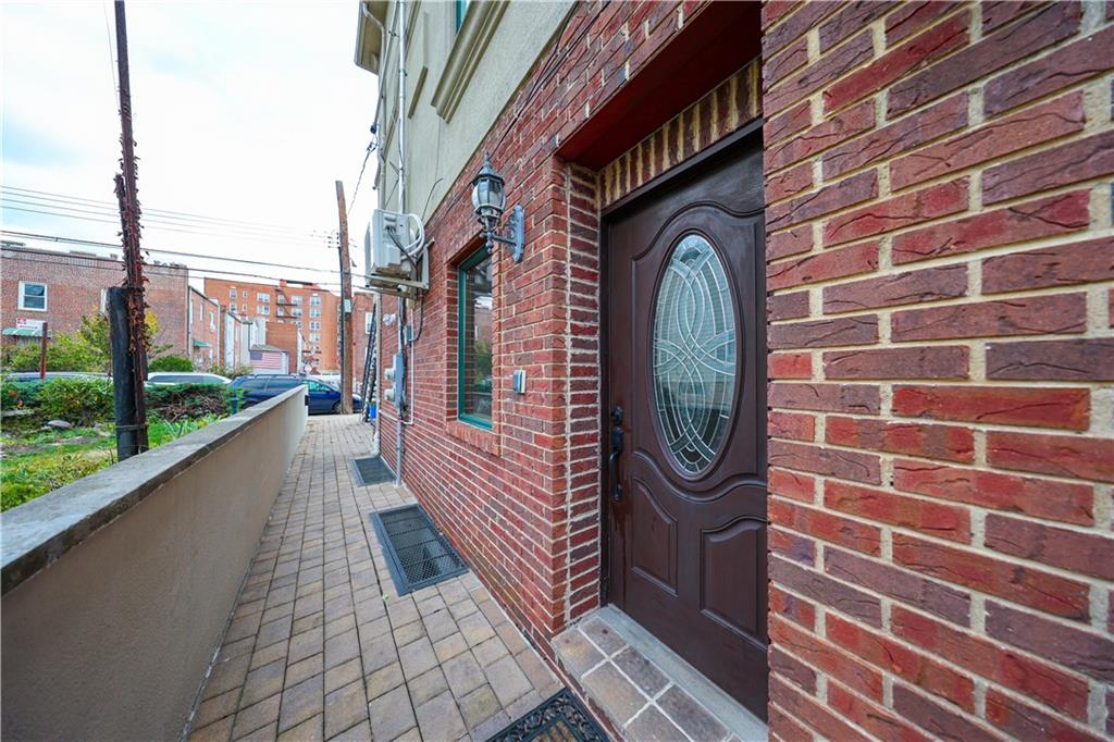 2568 East 2nd Street Brooklyn, NY 11223 - Photo 5 of 41 a view of a brick buildings with entryway