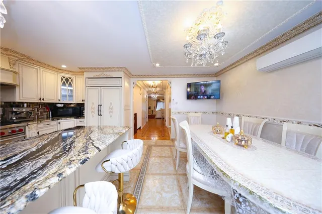 a kitchen with stainless steel appliances granite countertop a stove top oven a sink a counter top space and cabinets