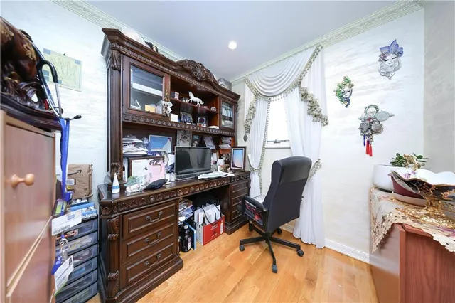 a living room with furniture a flat screen tv and a chandelier