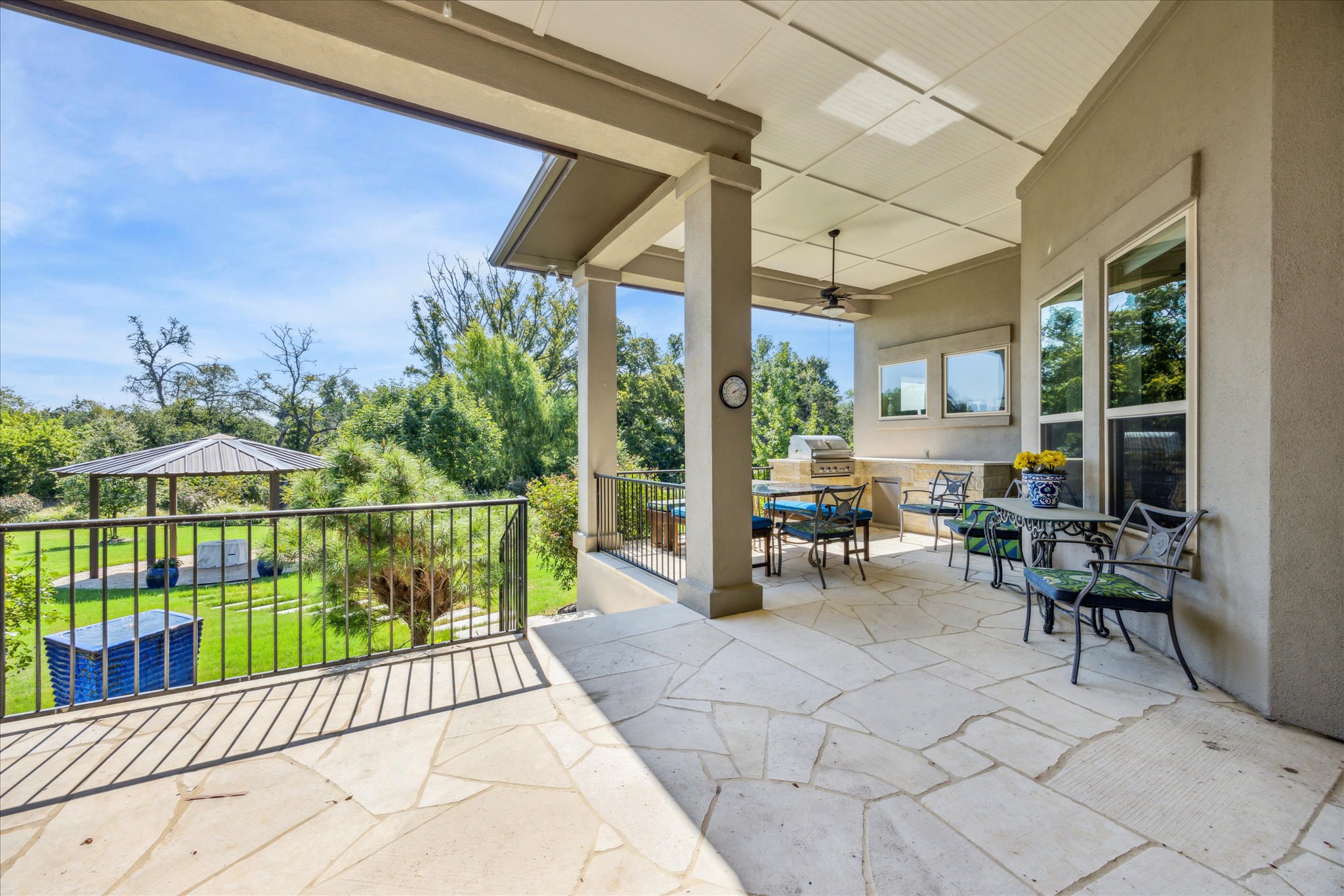 9600 Chamois Way Austin, TX 78736 - Photo 12 of 14 View of patio with ceiling fan, area for grilling, and outdoor dining area