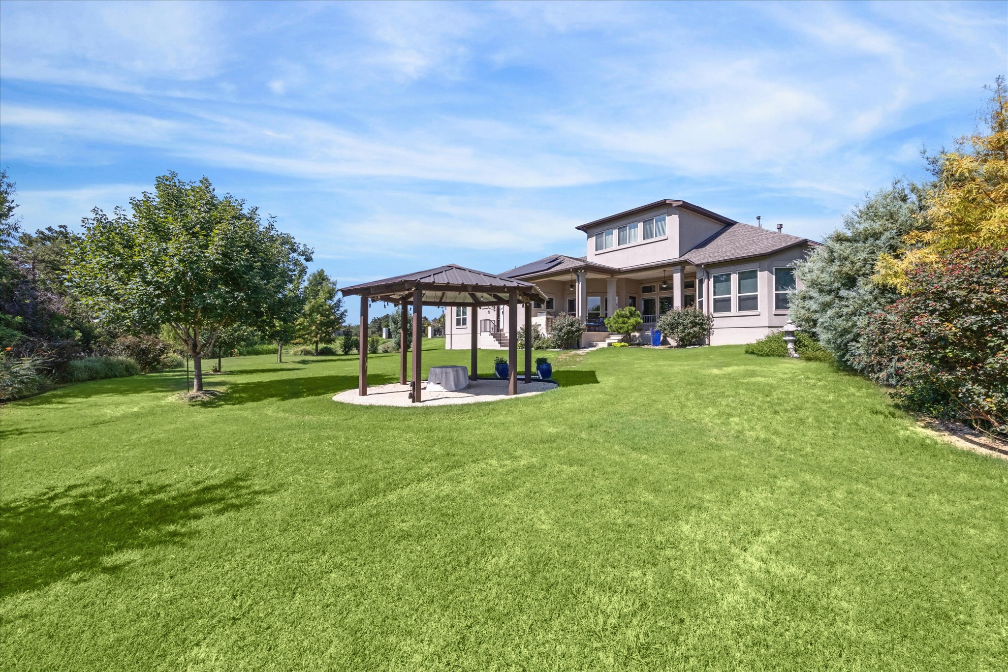 9600 Chamois Way Austin, TX 78736 - Photo 13 of 14 Rear view of property with a gazebo, a patio, and a yard
