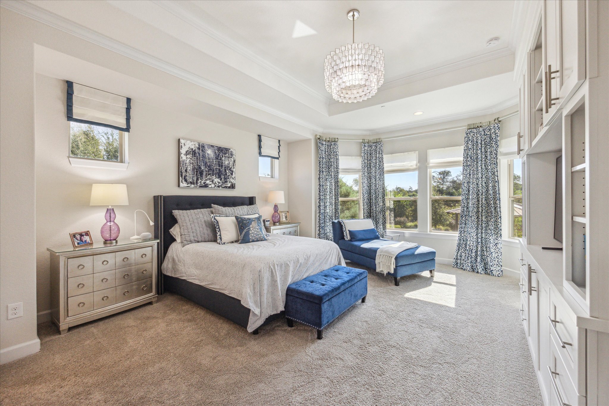 9600 Chamois Way Austin, TX 78736 - Photo 7 of 14 Bedroom featuring ornamental molding, a chandelier, carpet flooring, and multiple windows