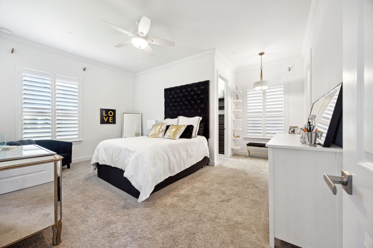 9600 Chamois Way Austin, TX 78736 - Photo 10 of 14 Bedroom featuring ornamental molding, light colored carpet, and ceiling fan