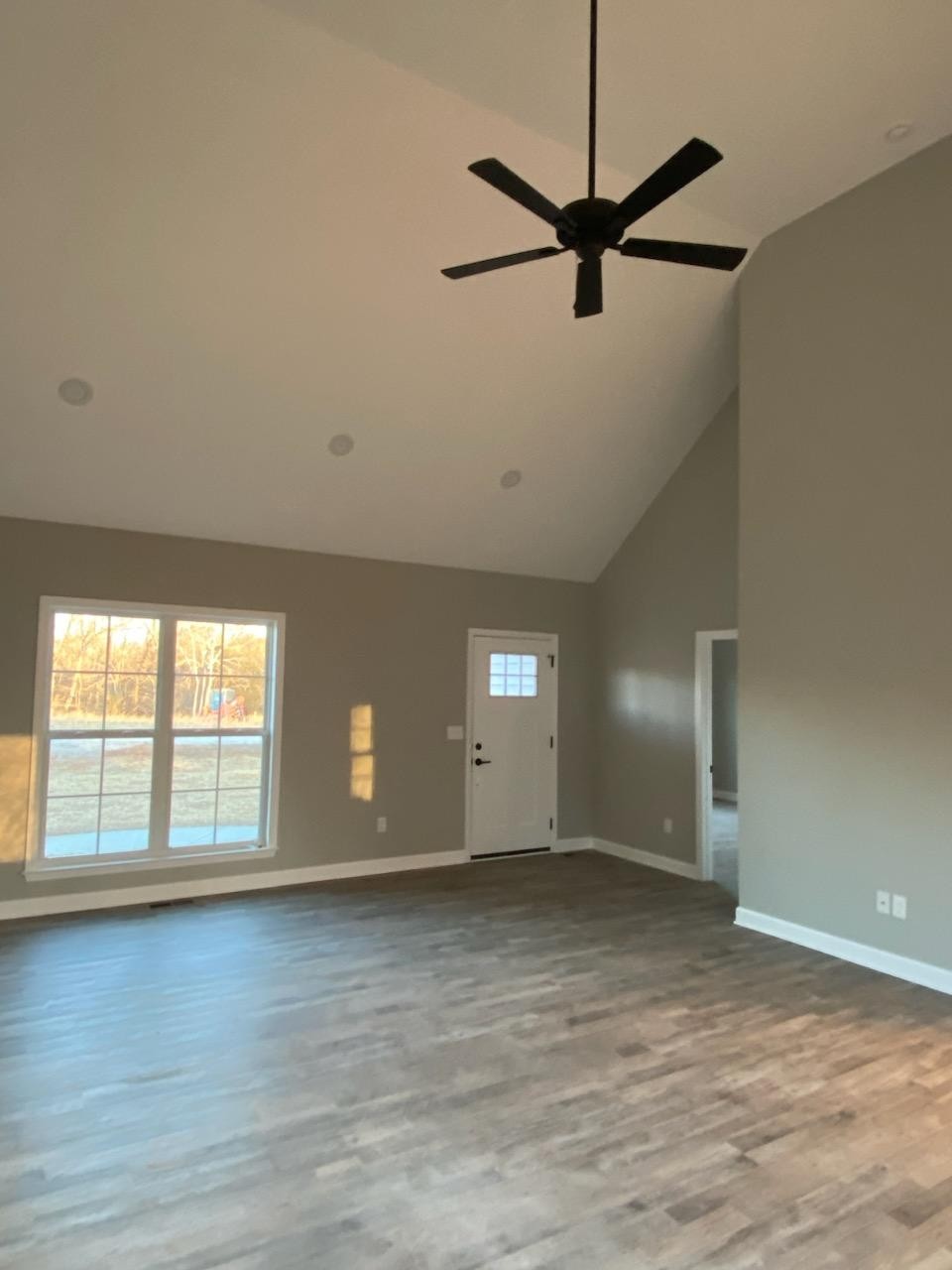 162 Pisgah Ridge Road Pulaski, TN 38478 - Photo 3 of 5 an empty room with wooden floor fan and windows