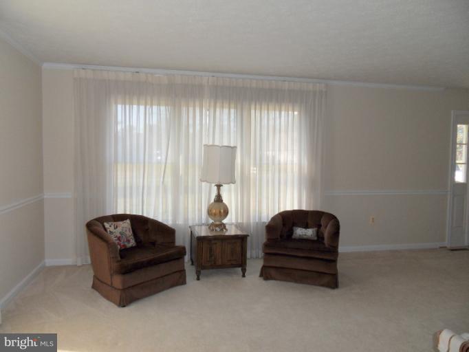 11026 George Street Lusby, MD 20657 - Photo 12 of 20 a living room with furniture and a window