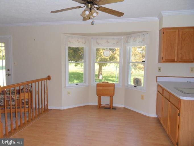 11026 George Street Lusby, MD 20657 - Photo 3 of 20 a view of an empty room with a window