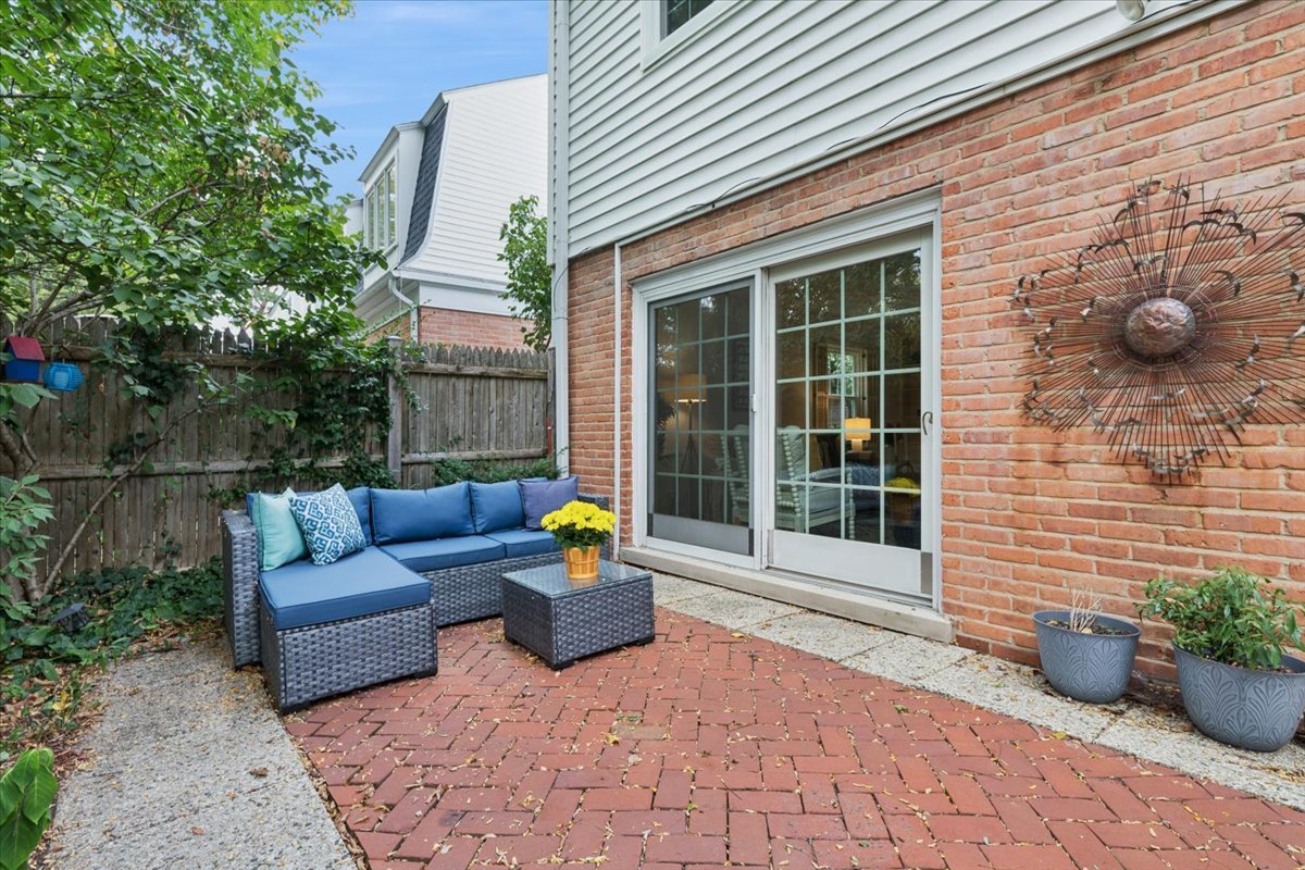 730 Oak Street Winnetka, IL 60093 - Photo 25 of 28 a view of a patio with couches chairs and potted plants