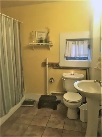 a bathroom with a sink and a toilet