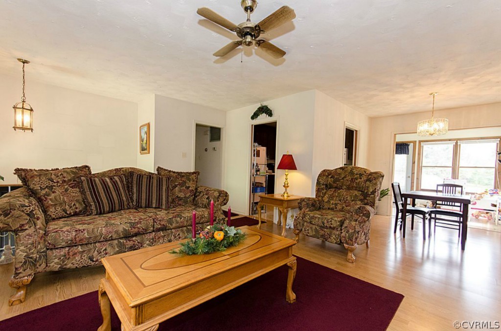15101 Rowlett Road Chesterfield, VA 23838 - Photo 7 of 16 a living room with furniture kitchen view and a large window