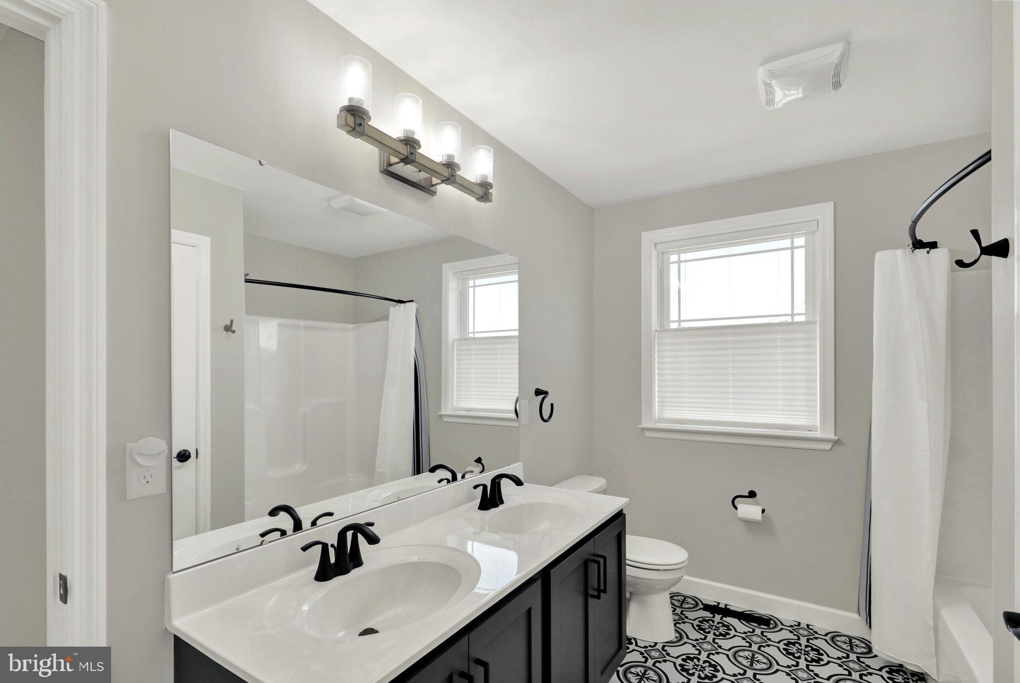 64 Middletown Road Fleetwood, PA 19522 - Photo 36 of 54 a bathroom with a sink toilet and mirror