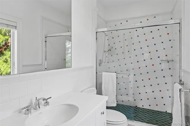 a bedroom with double bed and a window