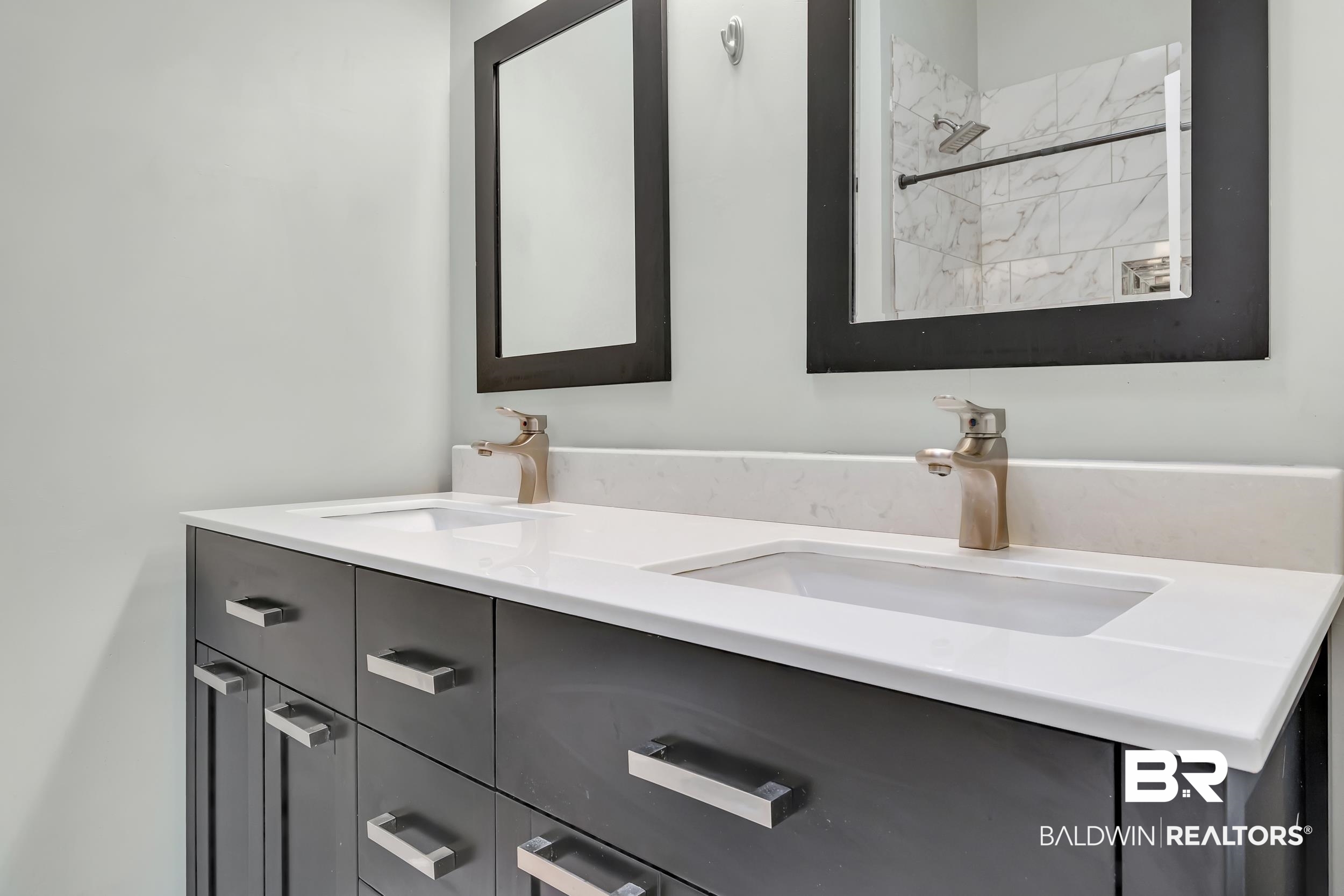 6616 Conde Court Mobile, AL 36695 - Photo 20 of 27 Bathroom with double vanity, a shower, and a sink