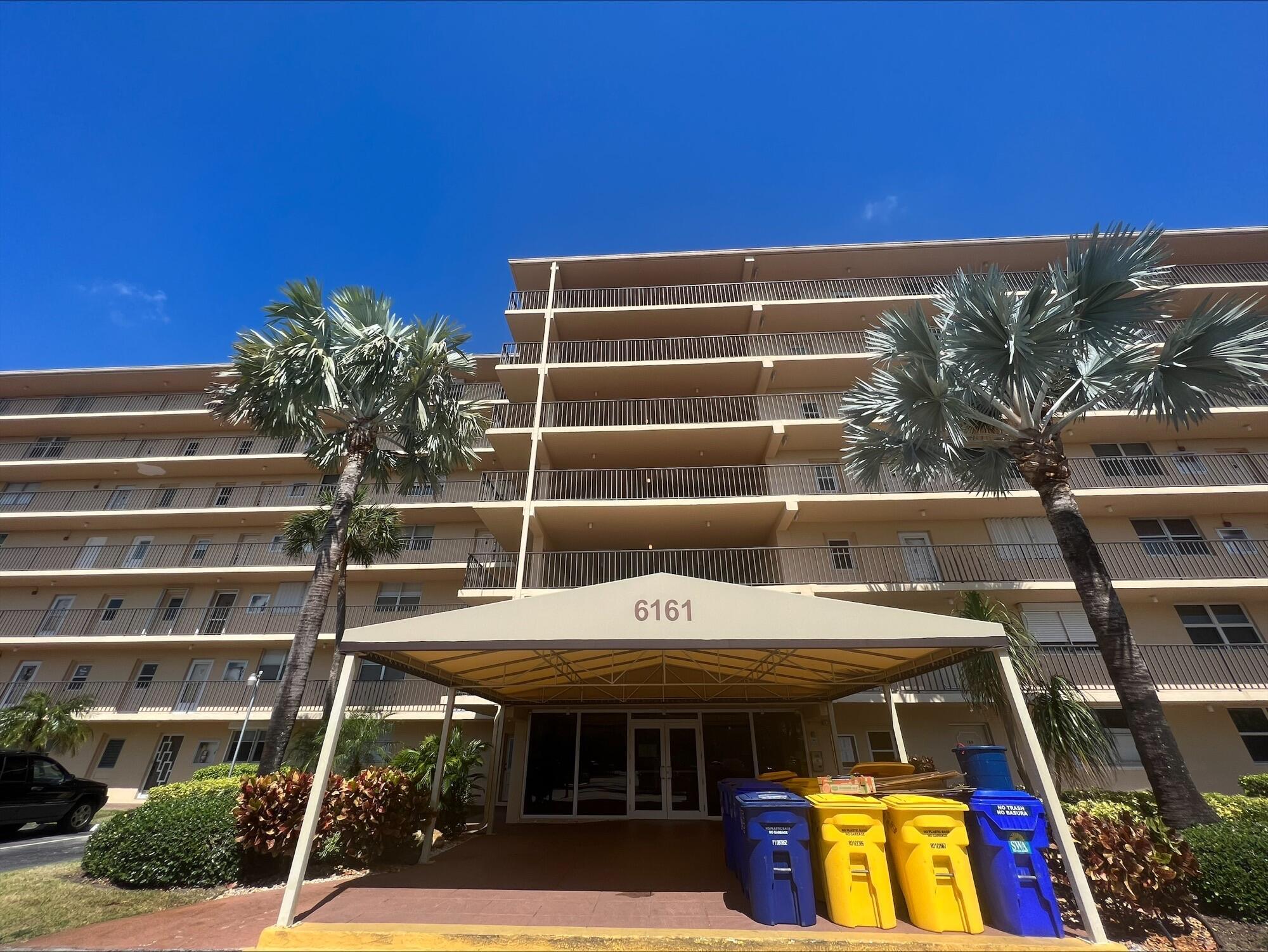 6161 Northwest 2nd Avenue, Unit 114 Boca Raton, FL 33487 - Photo 15 of 15 a view of a building with wooden floor and seating space