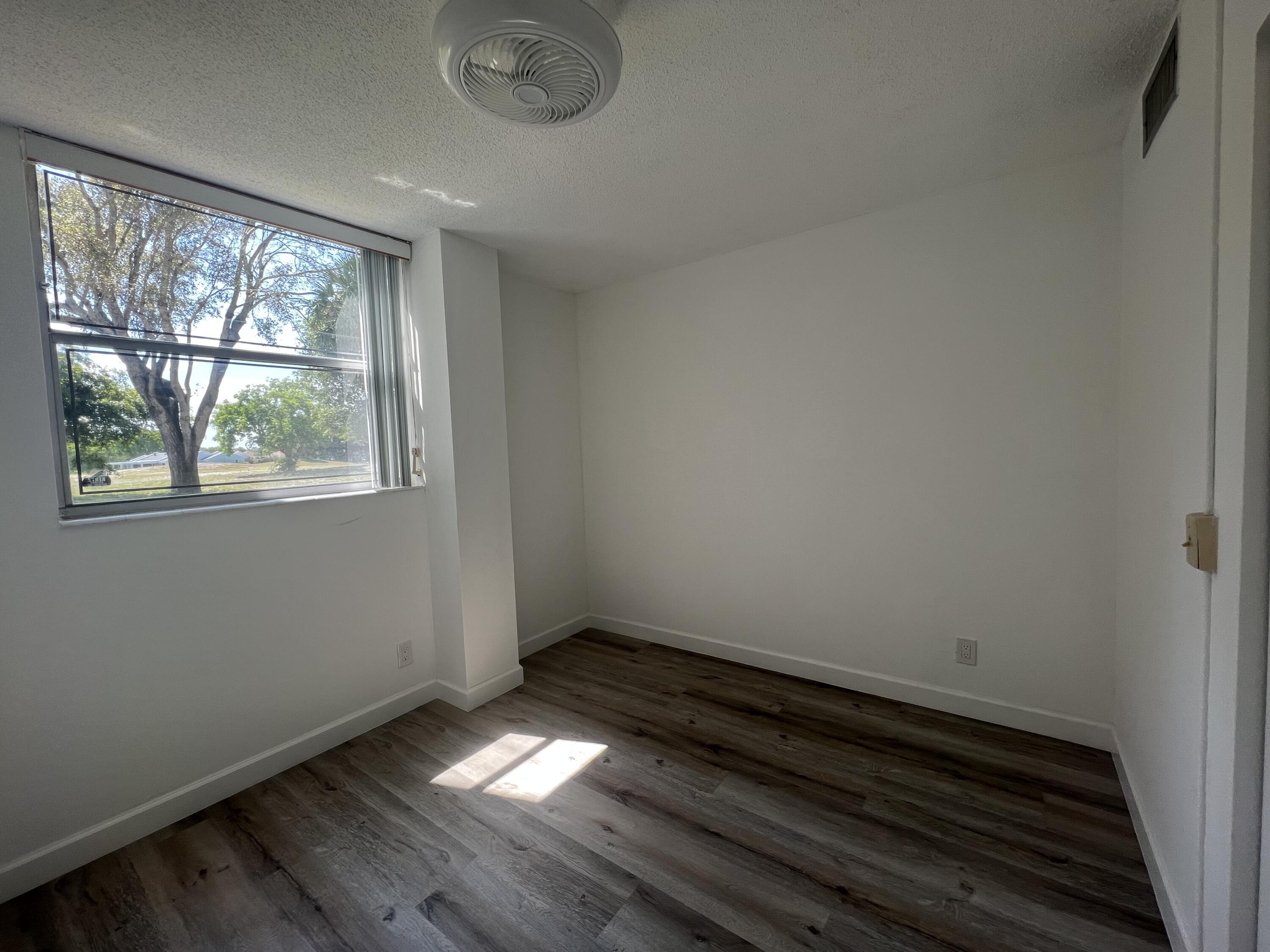6161 Northwest 2nd Avenue, Unit 114 Boca Raton, FL 33487 - Photo 5 of 15 a view of room with window