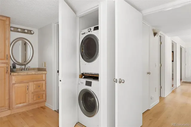 a view of a storage and utility room with washer and dryer