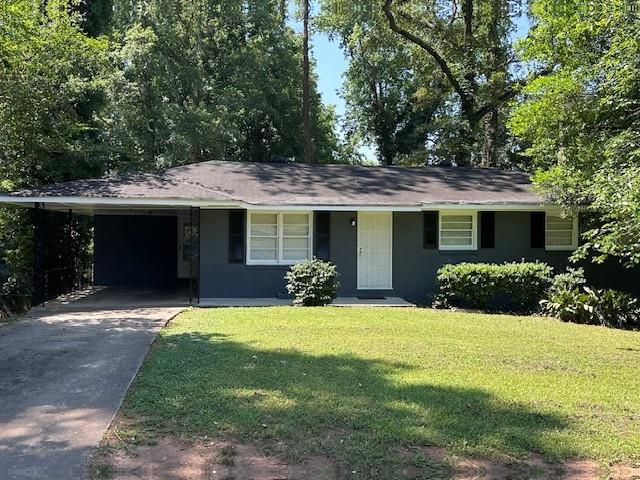 a front view of a house with yard and porch