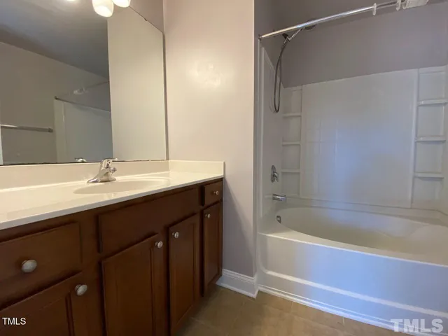 a bathroom with a bathtub and a sink