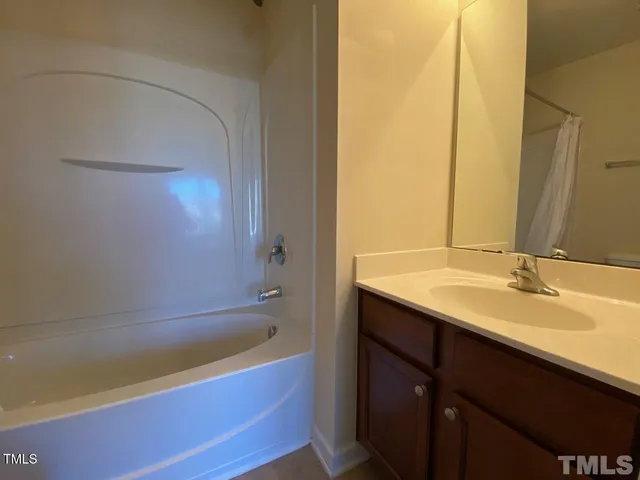 a bathroom with a bathtub and a sink