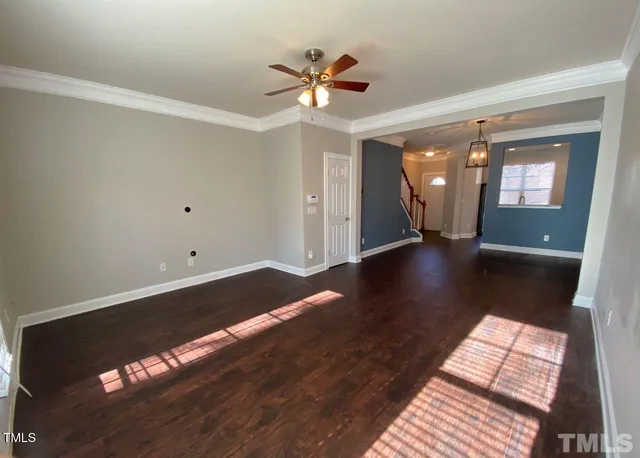 a view of livingroom with hardwood floor and ceiling fan
