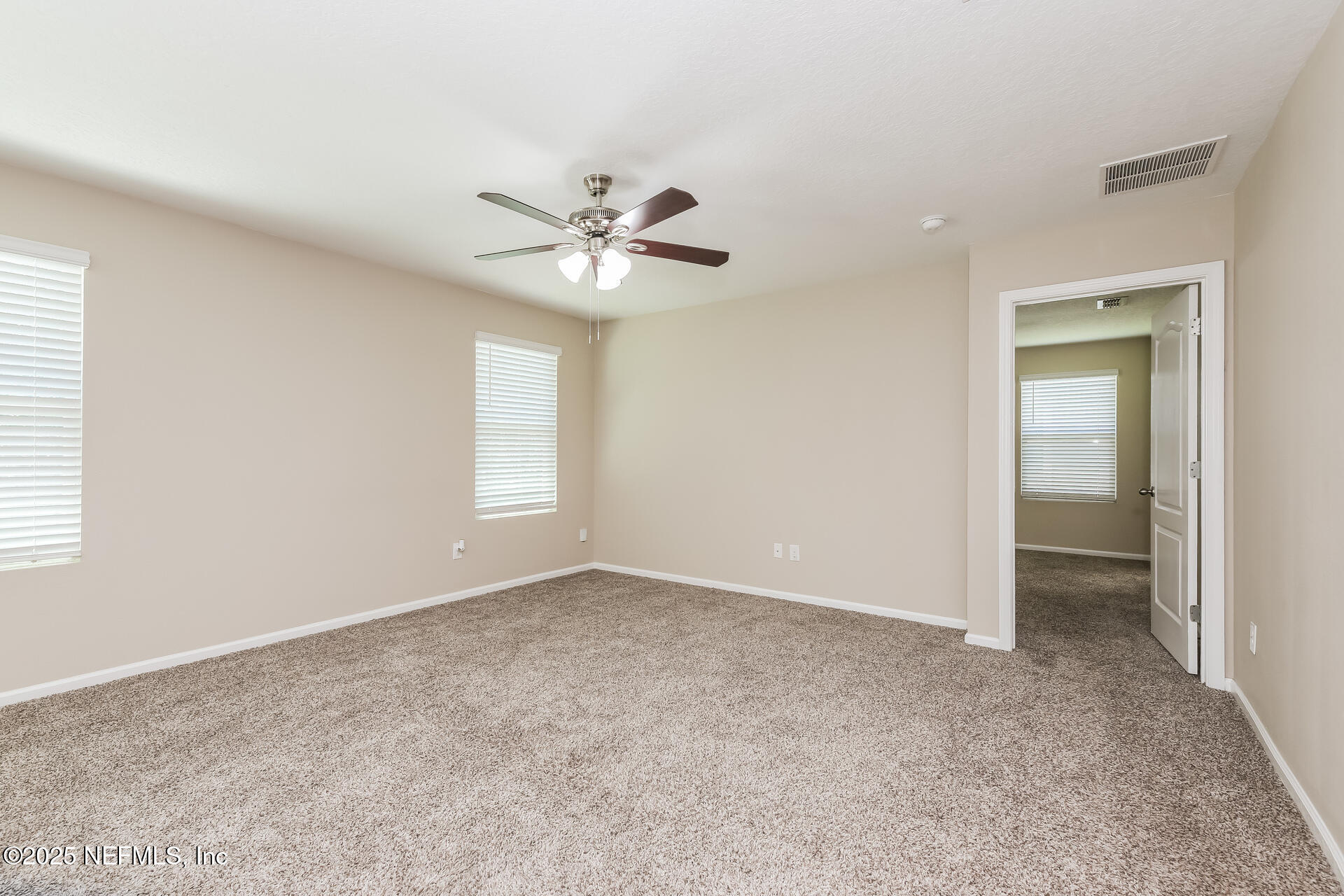 43 Cody Street St. Augustine, FL 32084 - Photo 11 of 15 an empty room with a ceiling fan and a window