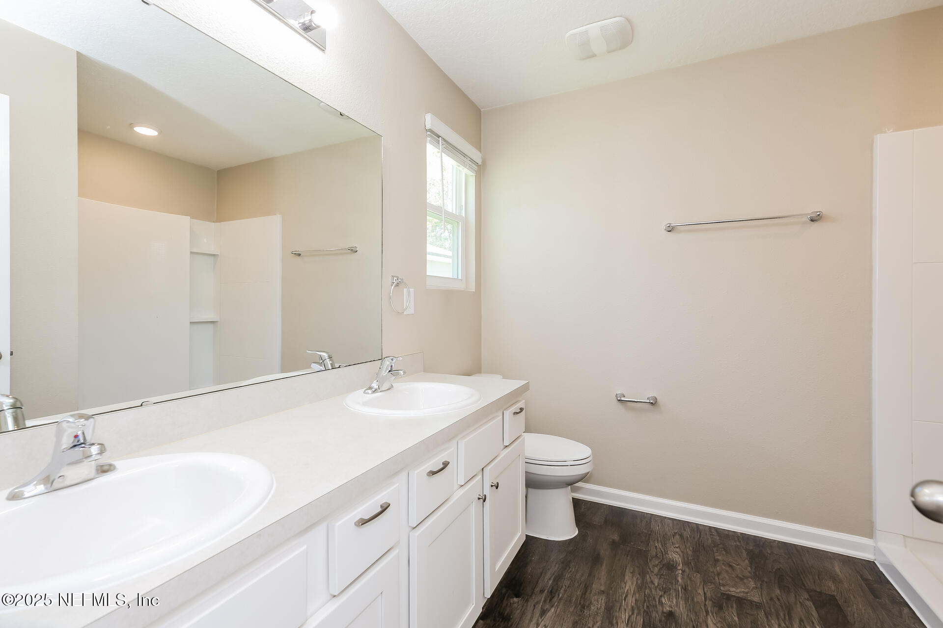 43 Cody Street St. Augustine, FL 32084 - Photo 9 of 15 a bathroom with a granite countertop sink a toilet and a mirror