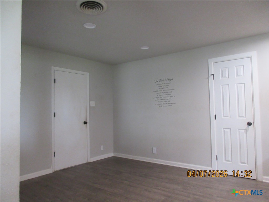 506 East Loop 121 Belton, TX 76513 - Photo 12 of 29 an empty room with wooden floor
