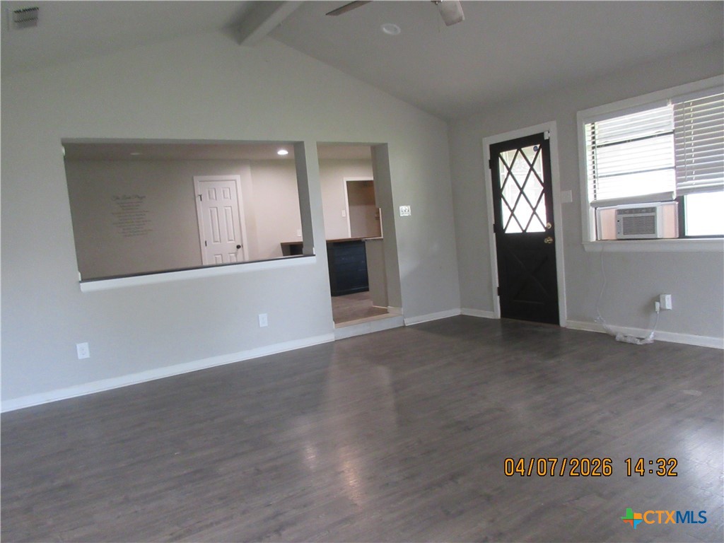 506 East Loop 121 Belton, TX 76513 - Photo 3 of 29 an empty room with wooden floor and windows