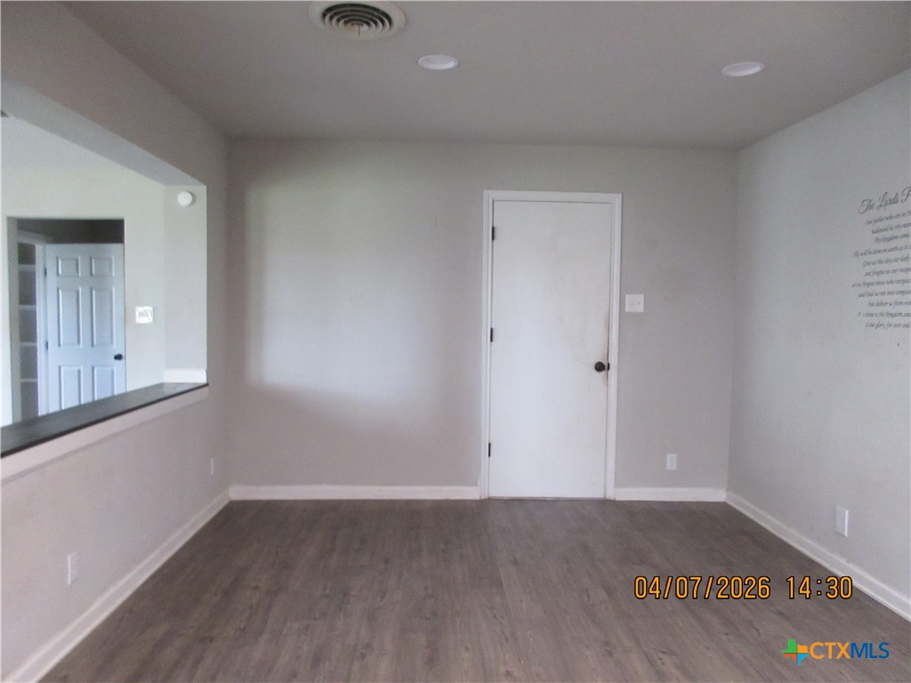506 East Loop 121 Belton, TX 76513 - Photo 4 of 29 an empty room with wooden floor and windows