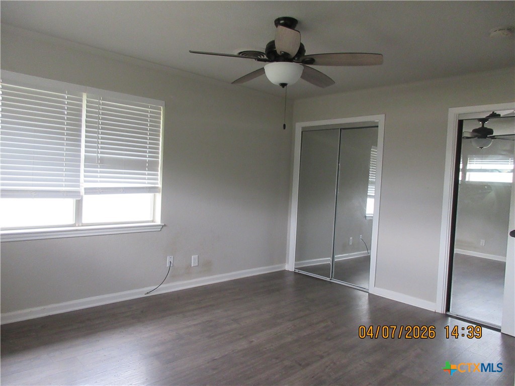 506 East Loop 121 Belton, TX 76513 - Photo 9 of 29 a view of an empty room with wooden floor and a window