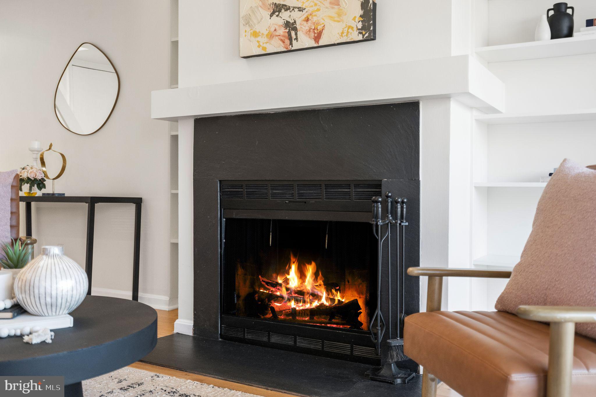 3225 Grace Street Northwest, Unit 226 Washington, DC 20007 - Photo 6 of 45 a living room with furniture and a fireplace