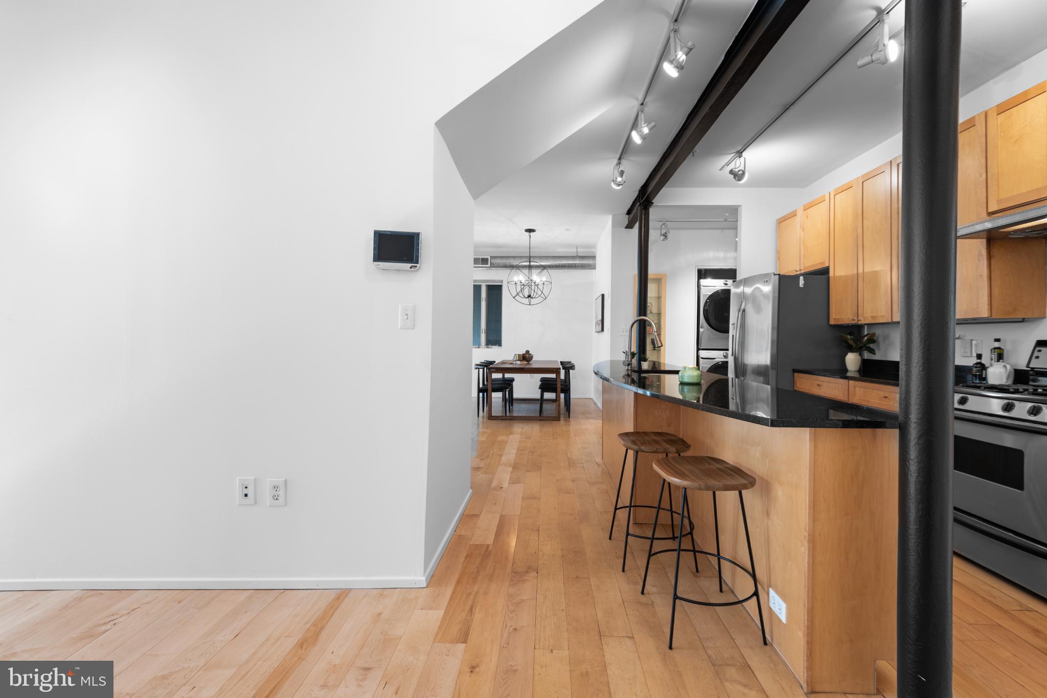 2307 15th Street Northwest, Unit 1 Washington, DC 20009 - Photo 21 of 43 a view of a living room and kitchen with a large window