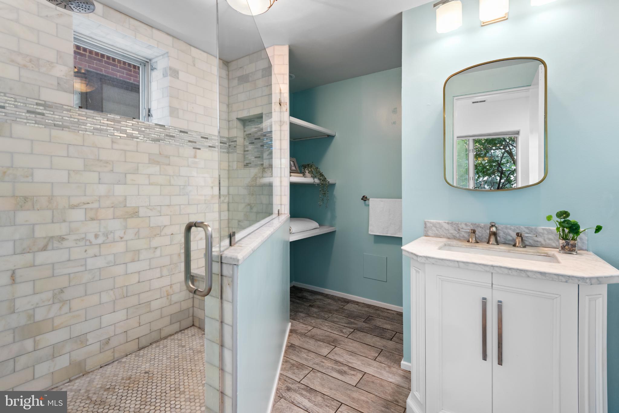 2307 15th Street Northwest, Unit 1 Washington, DC 20009 - Photo 30 of 43 a bathroom with a toilet sink and mirror