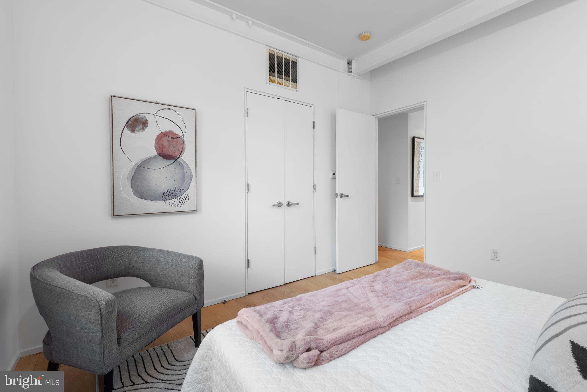 2307 15th Street Northwest, Unit 1 Washington, DC 20009 - Photo 33 of 43 a bedroom with a bed and couch
