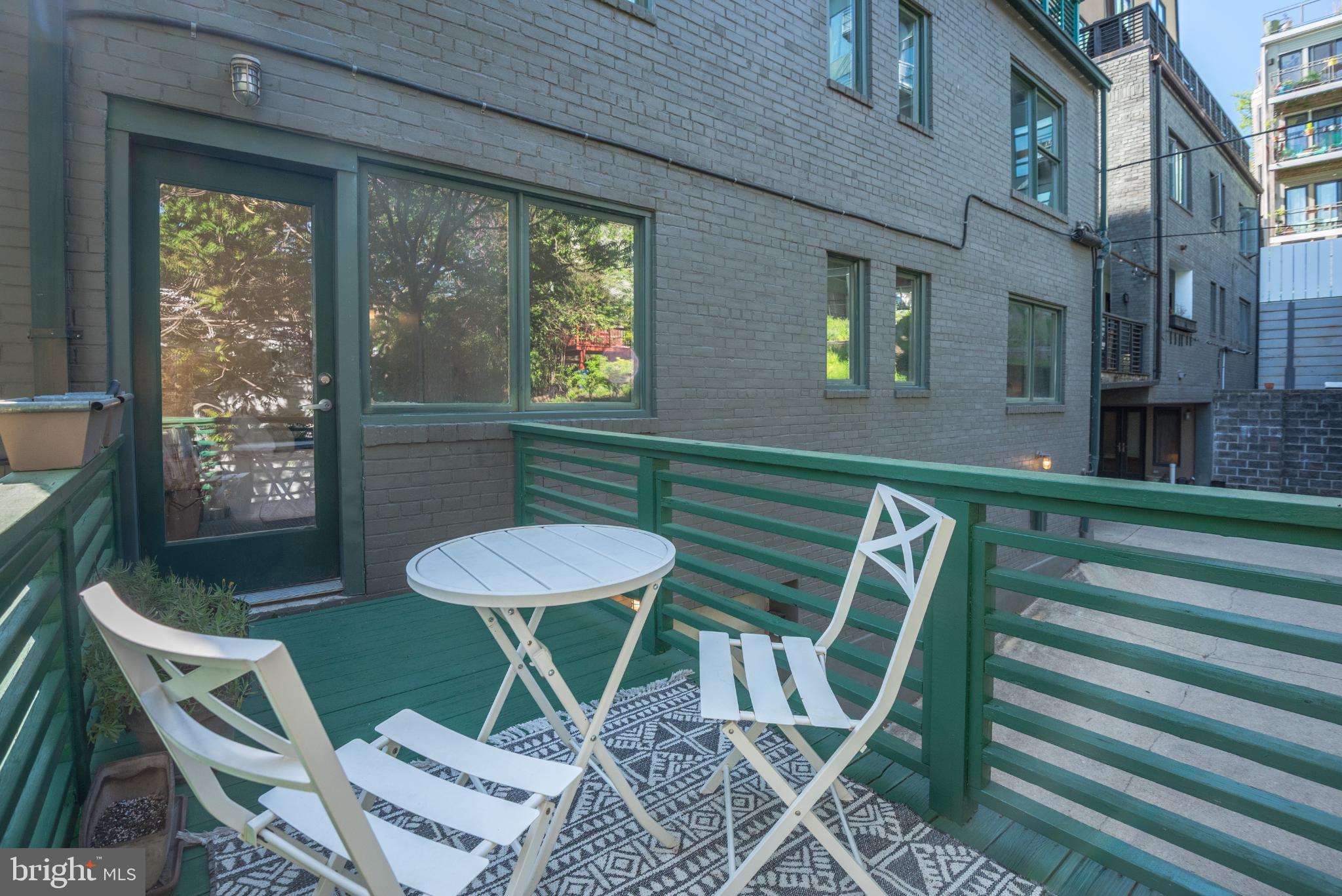 2307 15th Street Northwest, Unit 1 Washington, DC 20009 - Photo 40 of 43 a view of a chairs and table in a patio