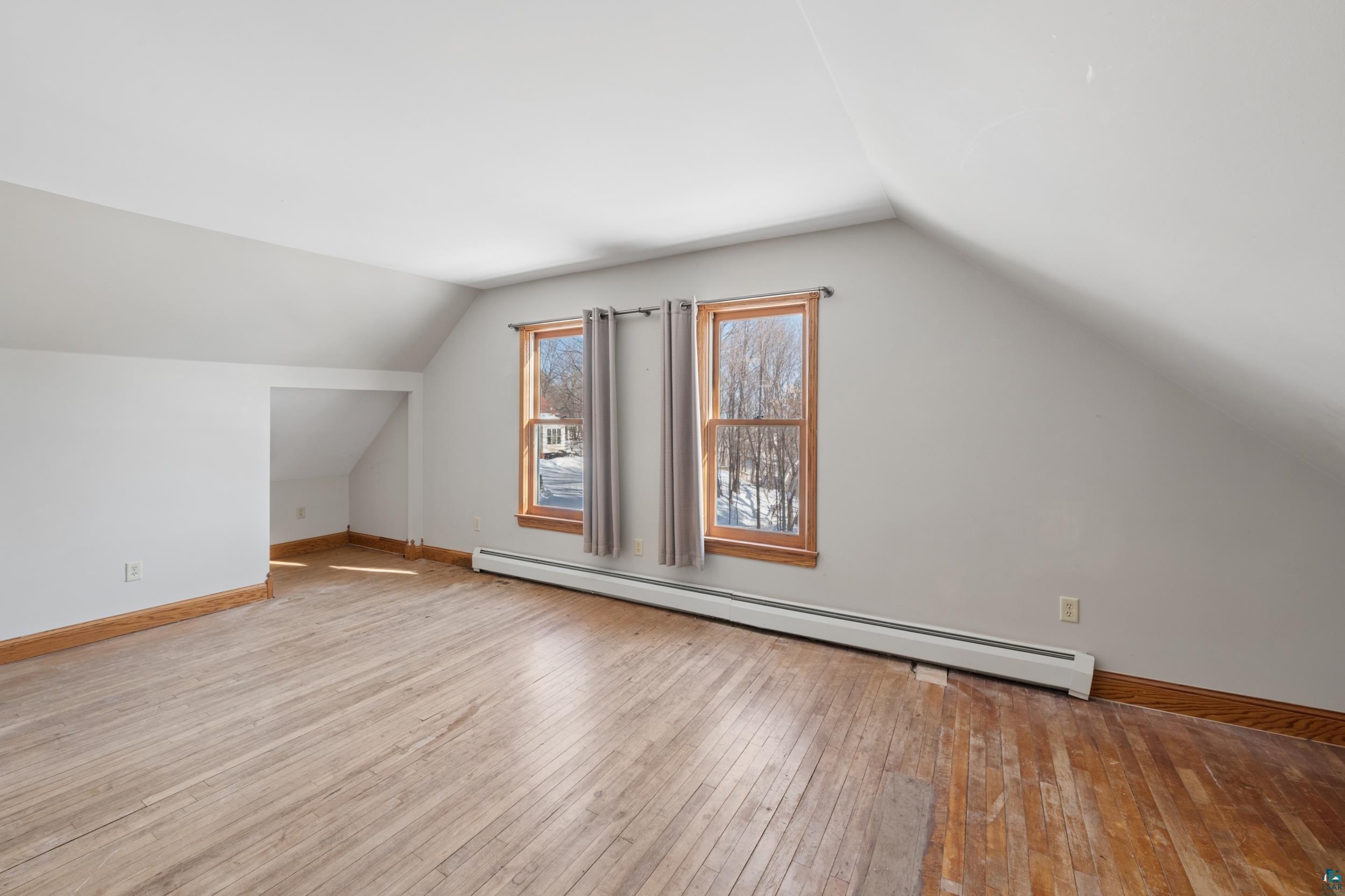 33 South 4th Street Bayfield, WI 54814 - Photo 21 of 29 Bonus room with a baseboard radiator and light wood-style floors