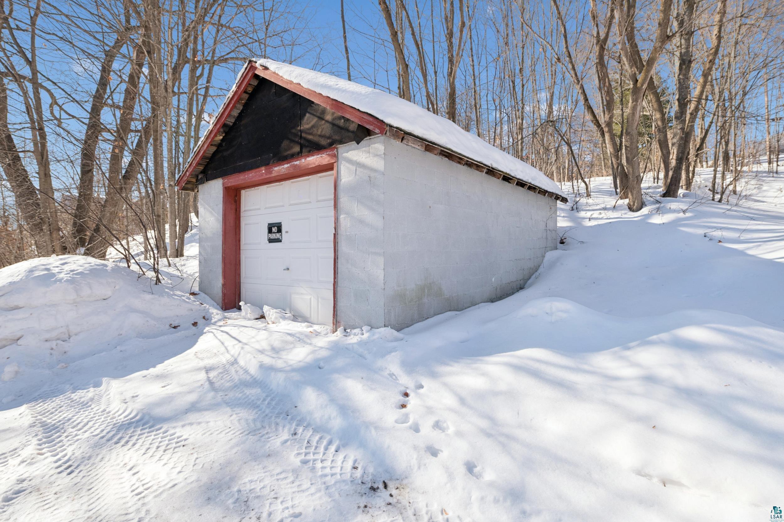 33 South 4th Street Bayfield, WI 54814 - Photo 28 of 29 Snow covered garage featuring a detached garage