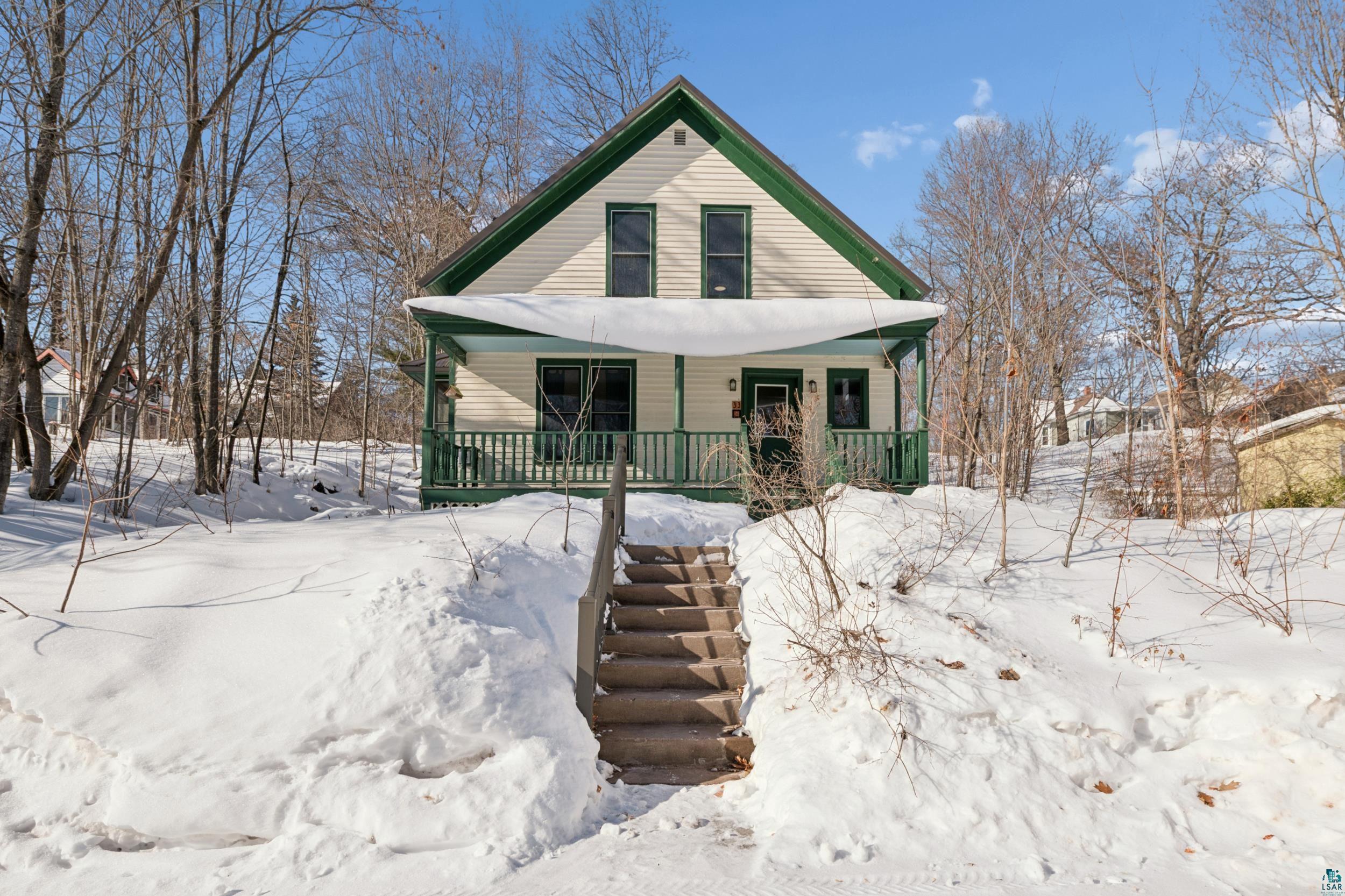 33 South 4th Street Bayfield, WI 54814 - Photo 3 of 29 View of front of house featuring covered porch and stairway