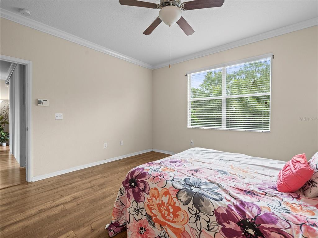 12722 Drakefield Drive Spring Hill, FL 34610 - Photo 28 of 45 a bedroom with a bed and a window